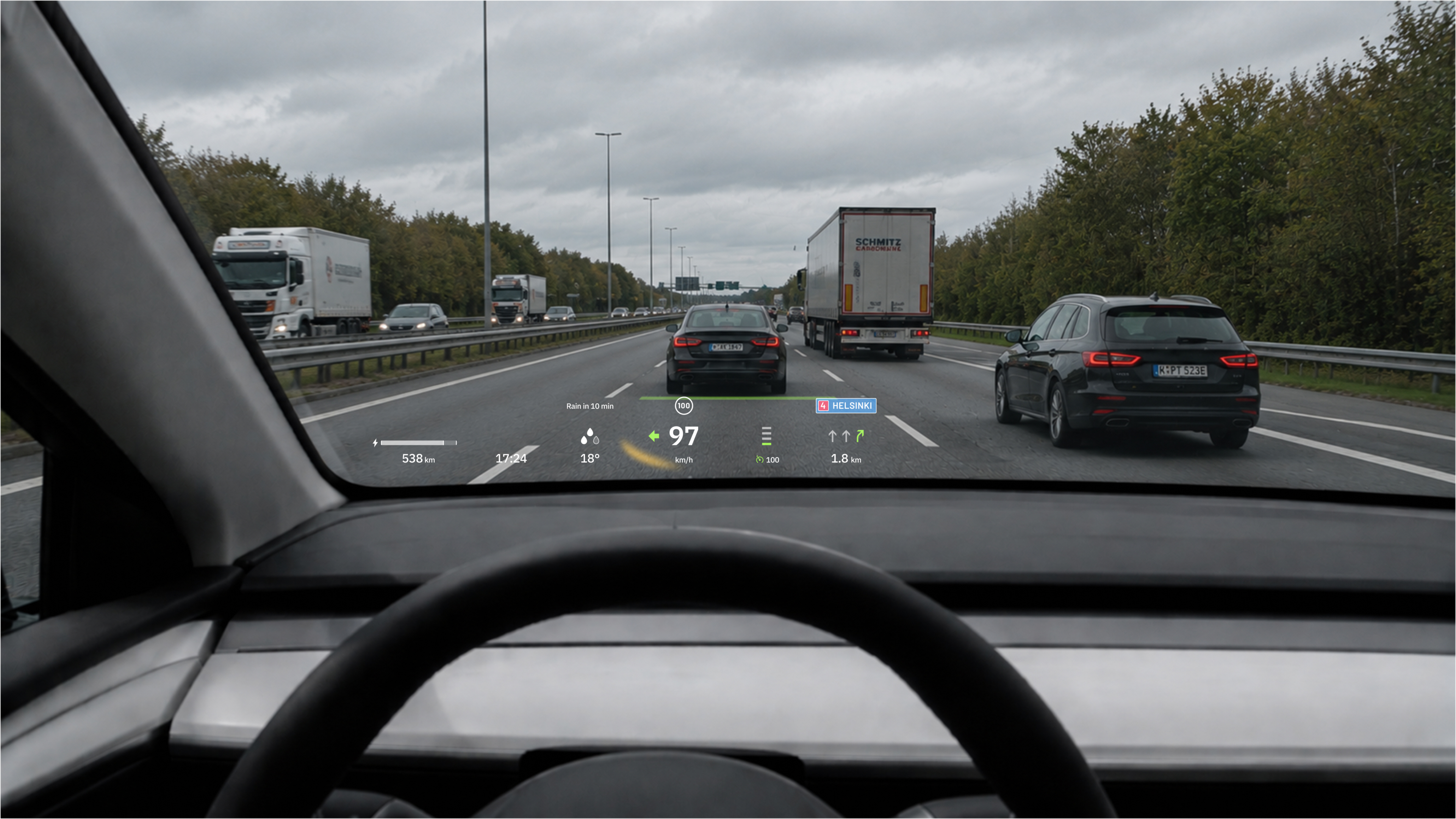 Driver view of a motorway with a head-up display showing speed, navigation and status information